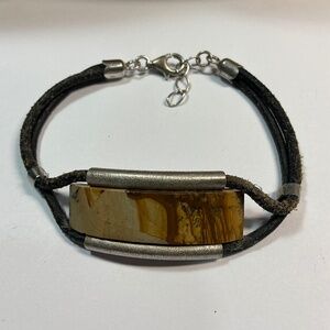 Sterling Silver and leather band bracelet with a Baltic Amber stone. 7 to 7.75”